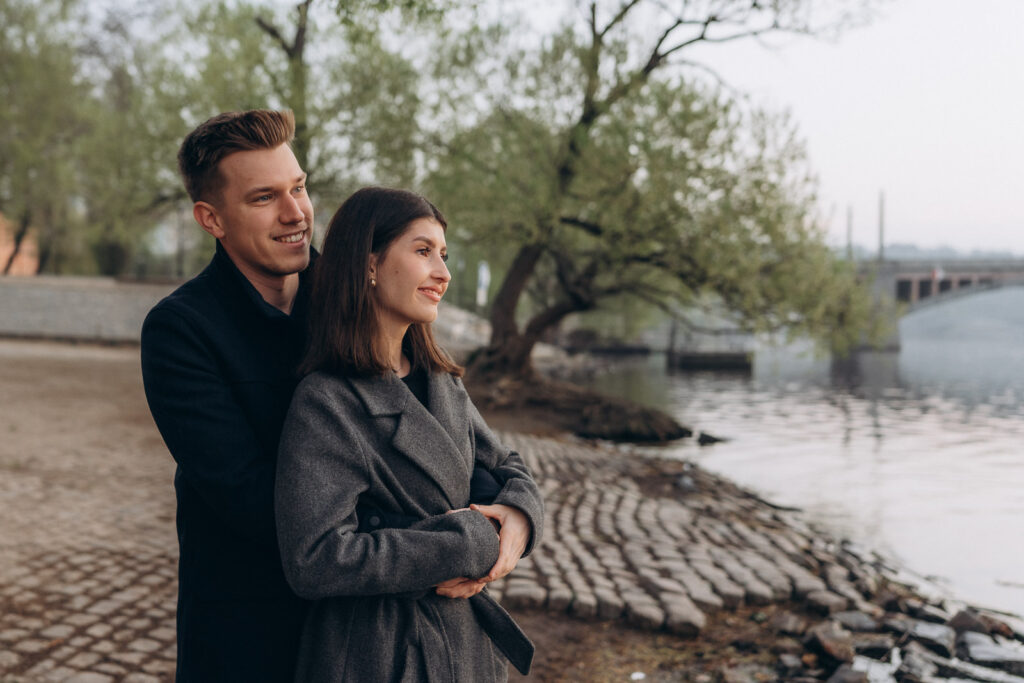Romantic couple in historic Prague by the river