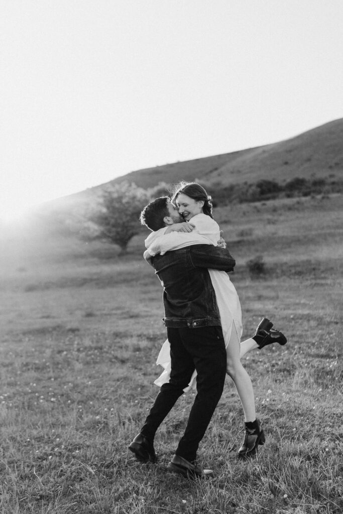 Couple hugging in nature near Prague in golden hour