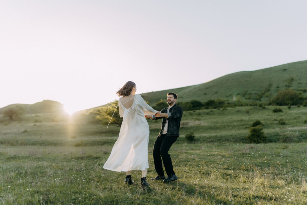 Couple dancing in nature near Prague in golden hour