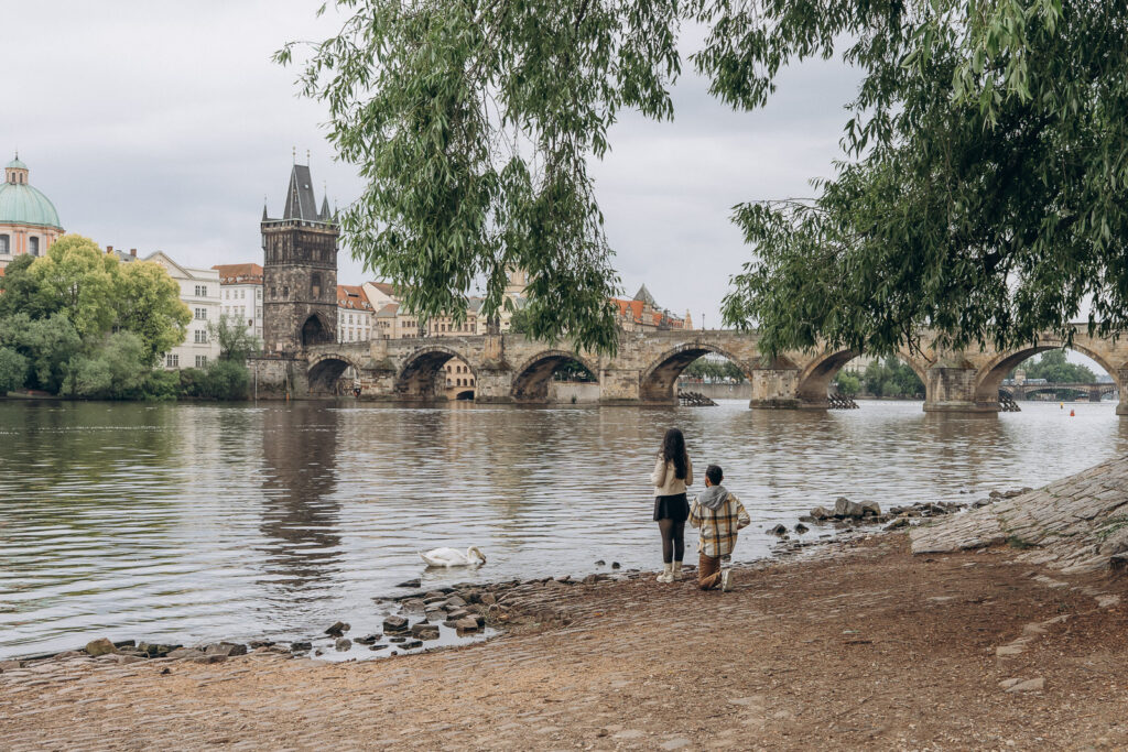 Surprise proposal in Prague with a view of Charles Bridge