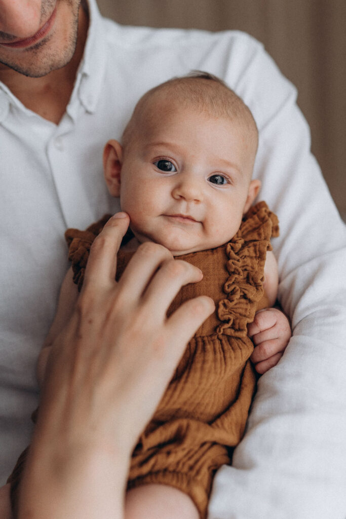 detail of the baby girl during home photoshoot in Prague
