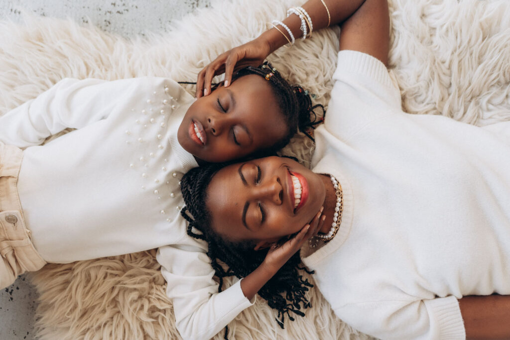 Mum and daughter posing together in Prague photography studio