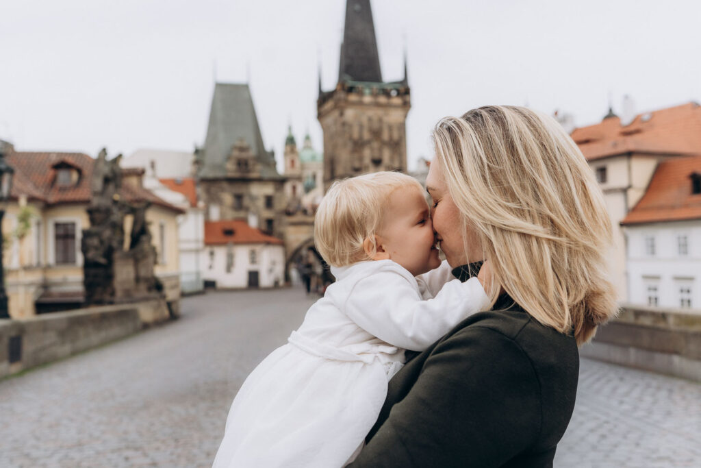 Cozy family photoshoot on Charles Bridge, Prague