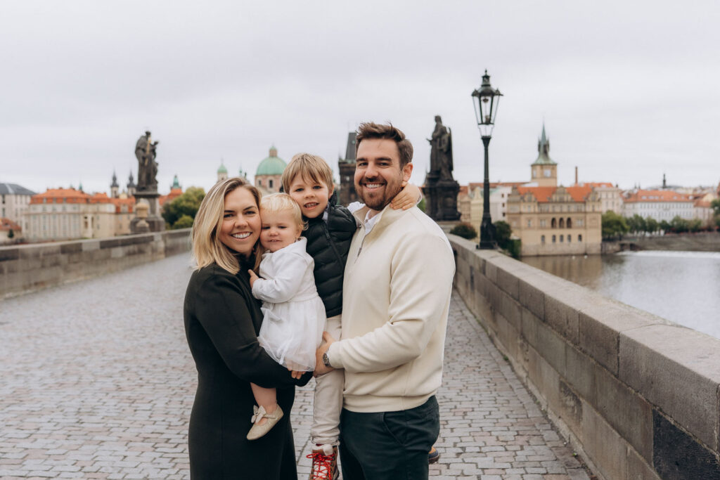 Cozy family photoshoot on Charles Bridge, Prague