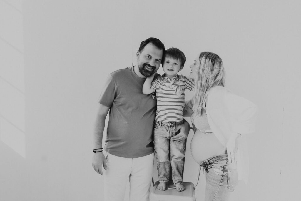 Studio maternity portrait session with mum, dad and toddler boy in Prague