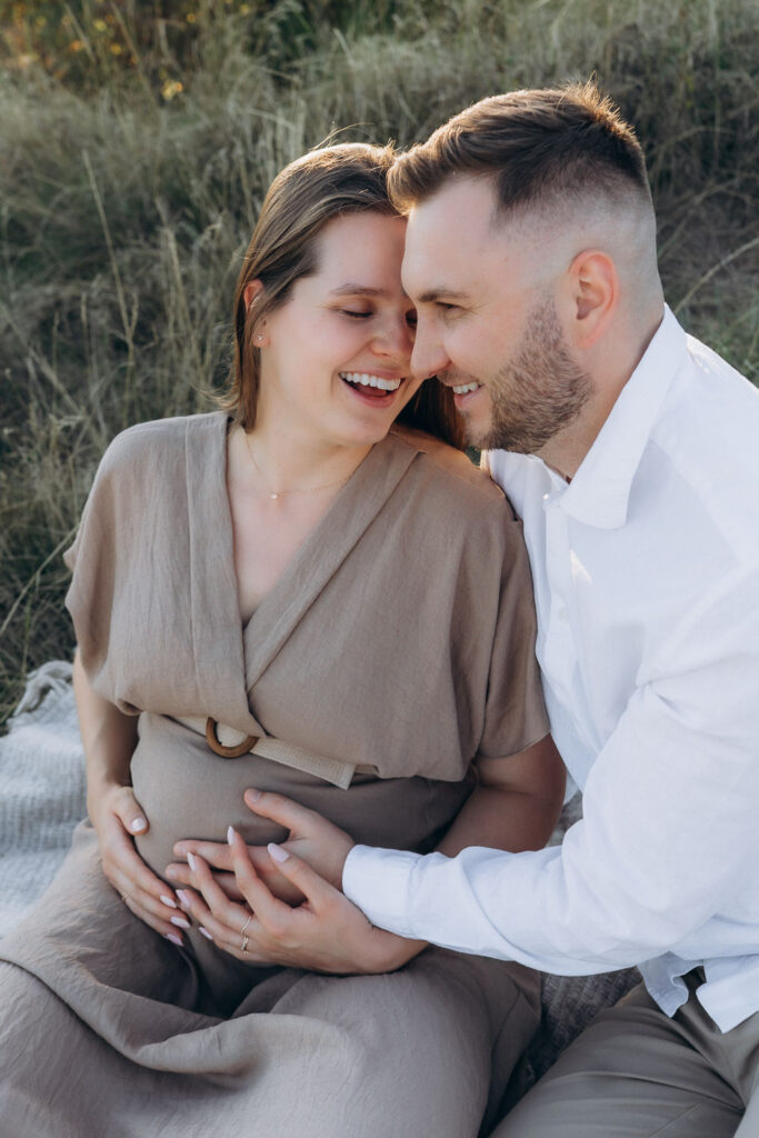 Pregnant woman enjoying peaceful summer maternity session in Divoká Šárka, Prague