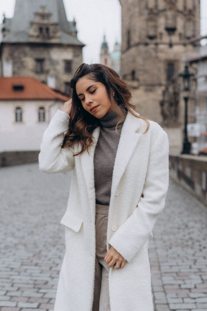 Urban female portrait photoshoot on Charles Bridge in Prague