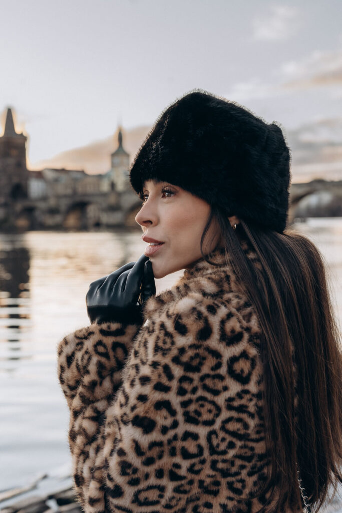 Individual portrait photoshoot in Prague city centre by the river near Charles Bridge