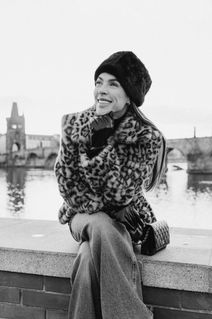 Casual portrait photoshoot in central Prague with the view of Charles Bridge