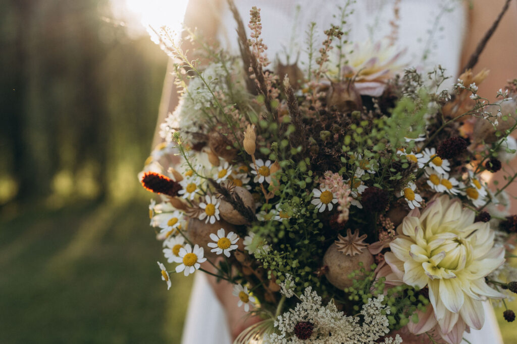 Outdoor wedding details of the flowers at easygoing venue near Prague