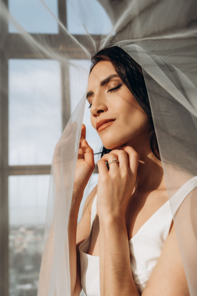 Natural light editorial portrait of bride at Prague National Museum