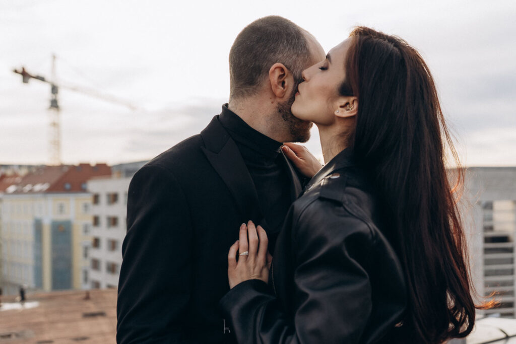 Wedding couple posing on rooftop with Prague National Museum in the background