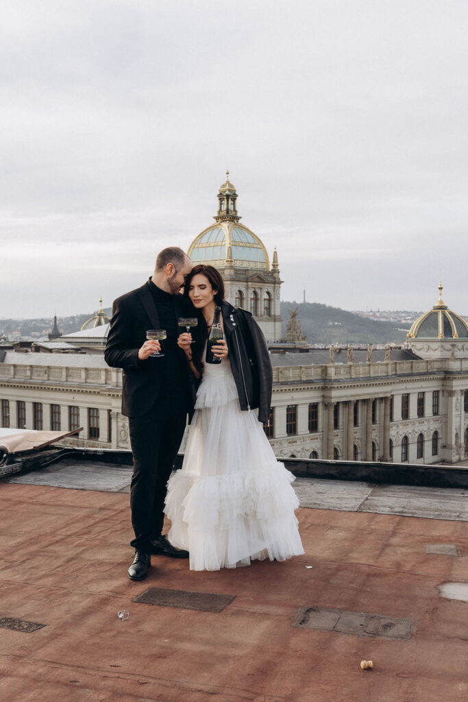Rooftop portraits of bride and groom with Prague National Museum city view