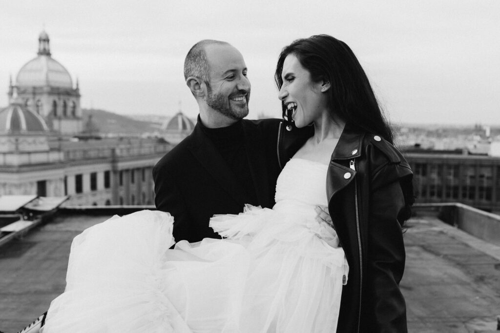 Wedding couple portrait session on rooftop with Prague city and National Museum view