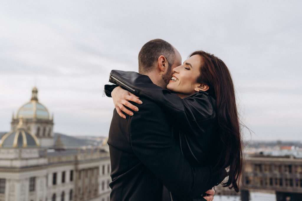 Romantic rooftop wedding photography of couple near Prague National Museum