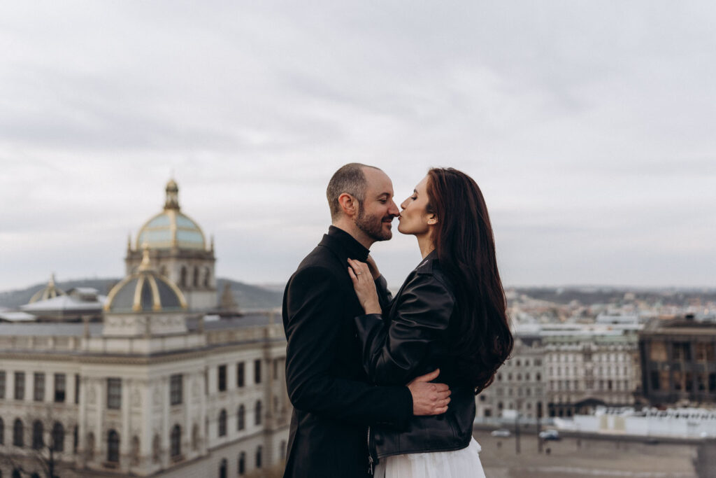 Romantic rooftop wedding photography of couple near Prague National Museum