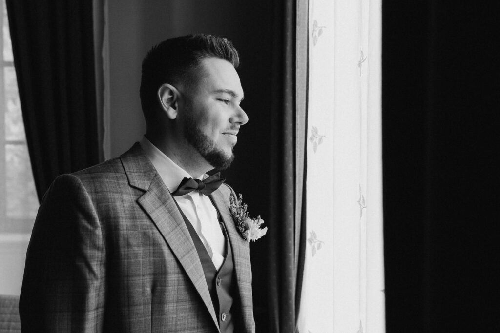 groom portrait on wedding venue near prague