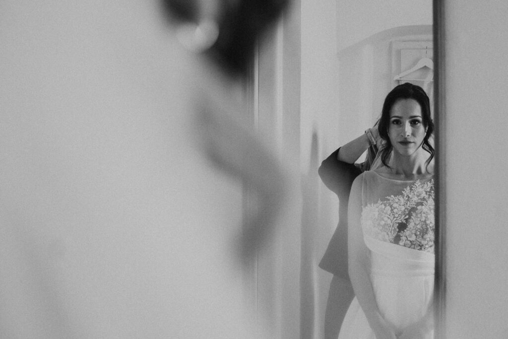 bride getting ready with hair stylist at wedding venue near prague