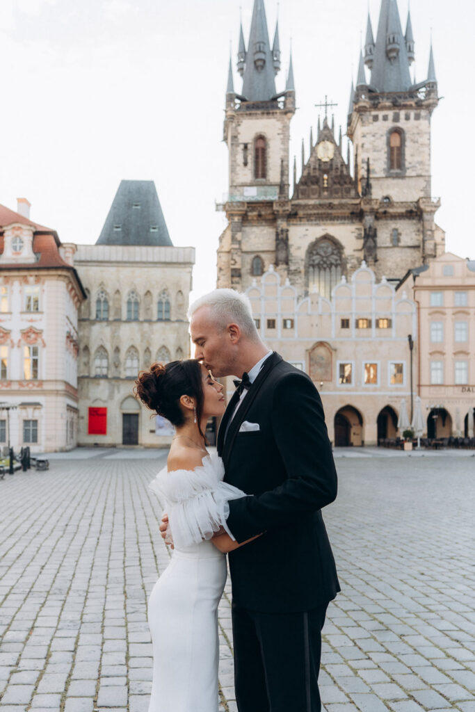 Sunrise wedding portraits in Prague Old Town Square