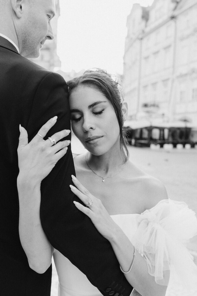 Wedding portraits with Prague Old Town Square in early morning light