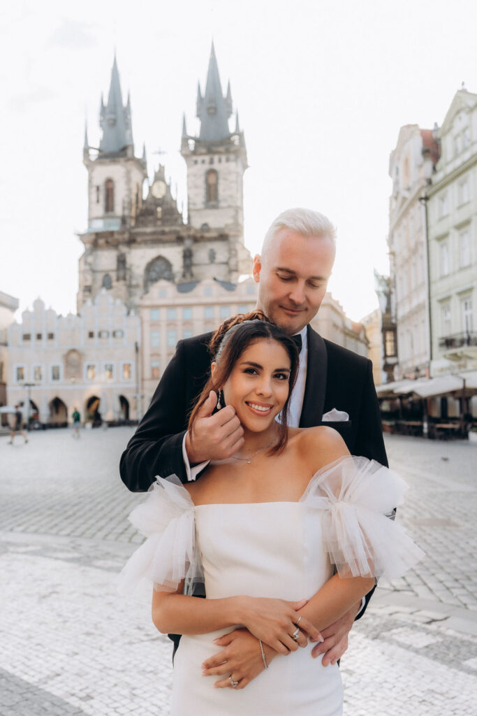 Sunrise wedding photography in historic Old Town Square, Prague”
