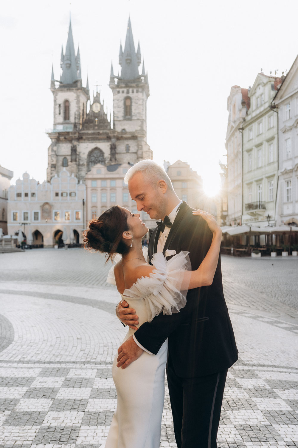 Wedding portraits in Prague Old Town Square during early morning light