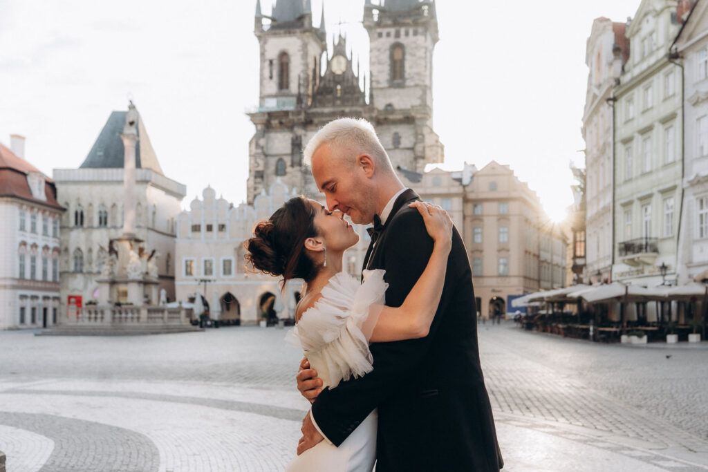 Romantic sunrise wedding portraits in Prague Old Town Square