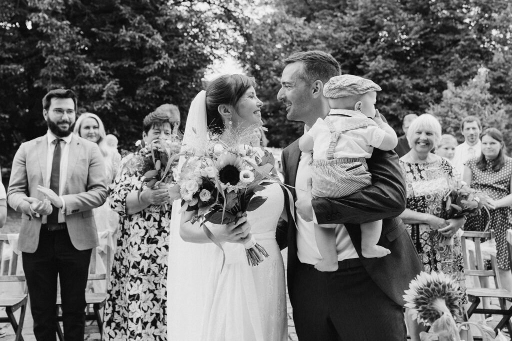 Bride and groom sharing moment during outdoor wedding in Prague