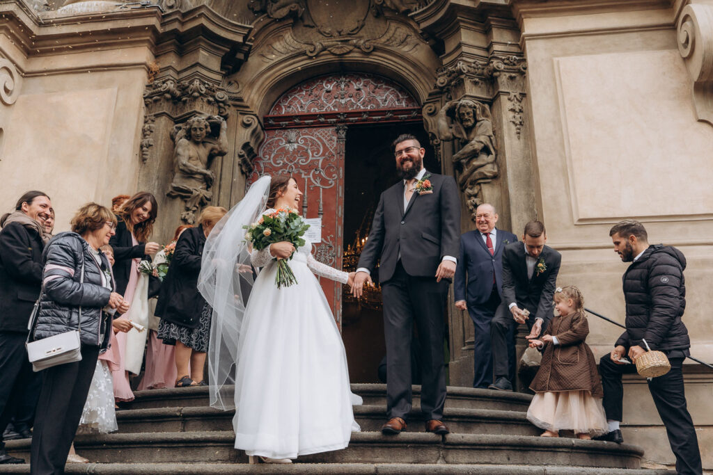 Church wedding ceremony photography in Prague Old Town Square during autumn