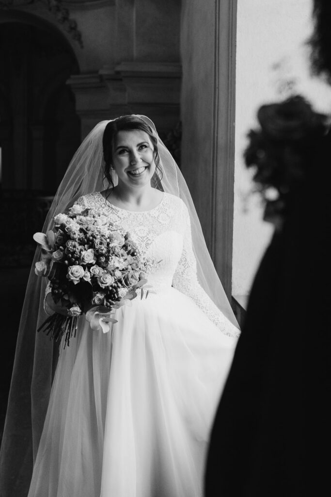 Wedding couple portraits after church ceremony in Old Town Square, Prague
