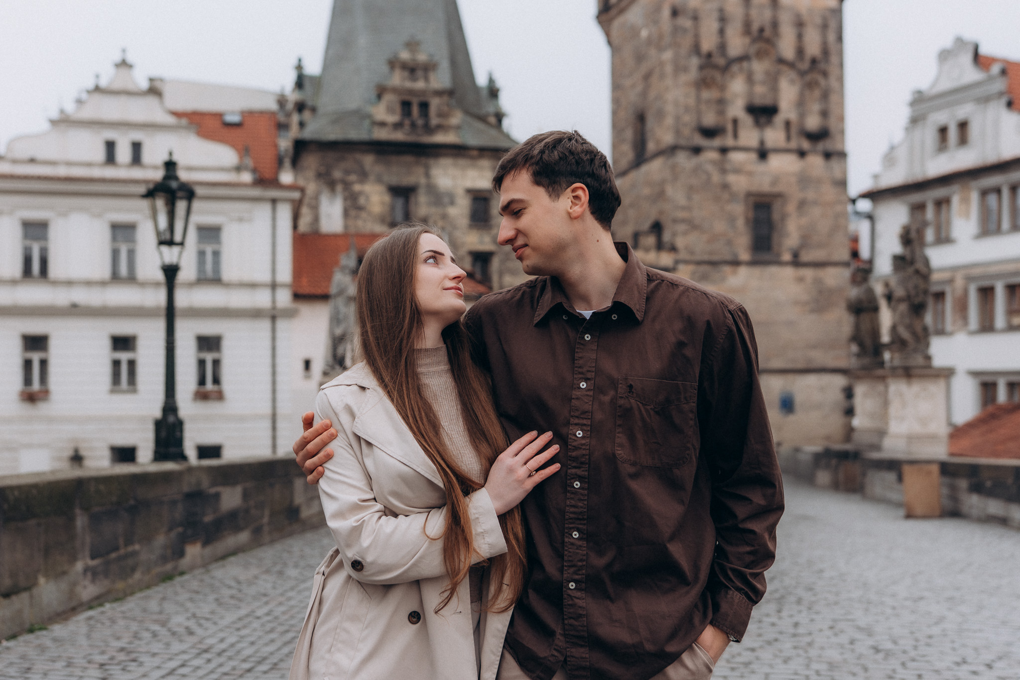 Romantic travel photoshoot Prague Charles Bridge Europe
