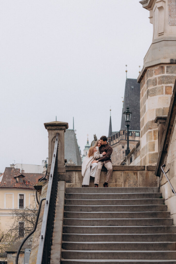 Couple portrait on Charles Bridge Prague historic old town