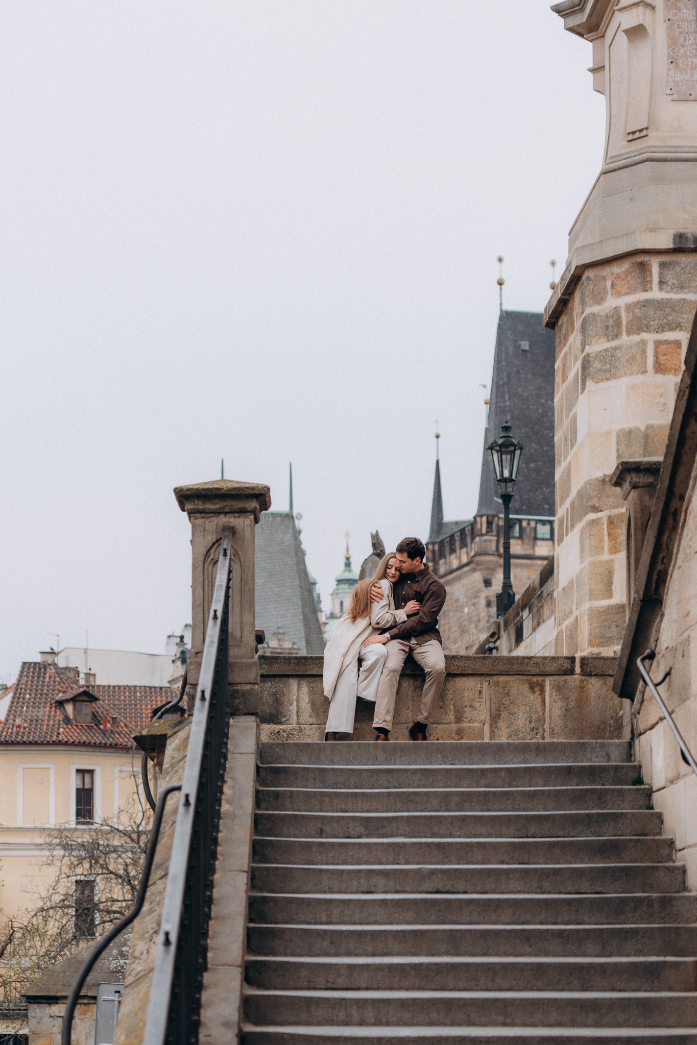 Couple portrait on Charles Bridge Prague historic old town